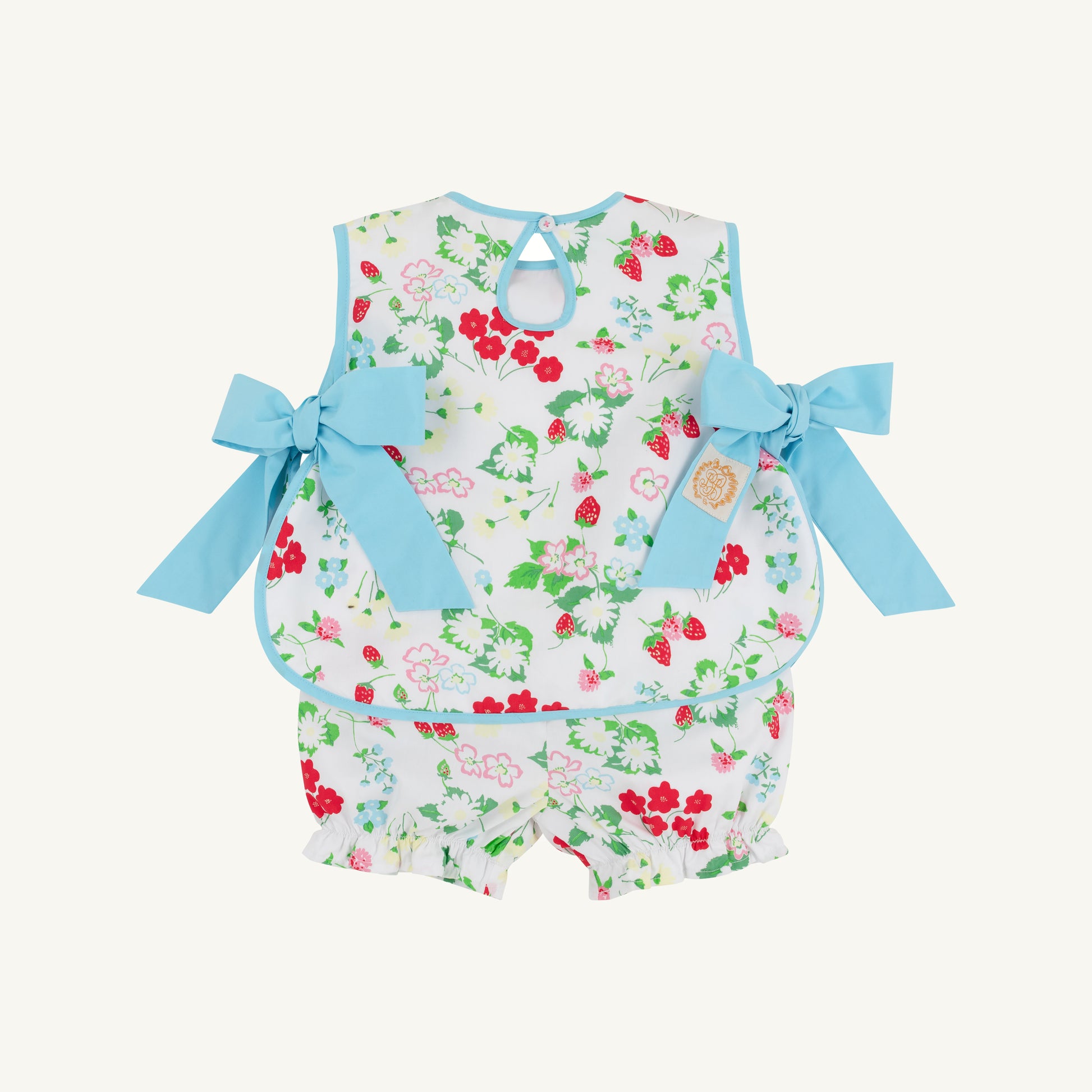 Berry Sweet and Belhaven Blue Talbott tie side swimsuit by The Beaufort Bonnet Company, featuring colorful floral patterns.