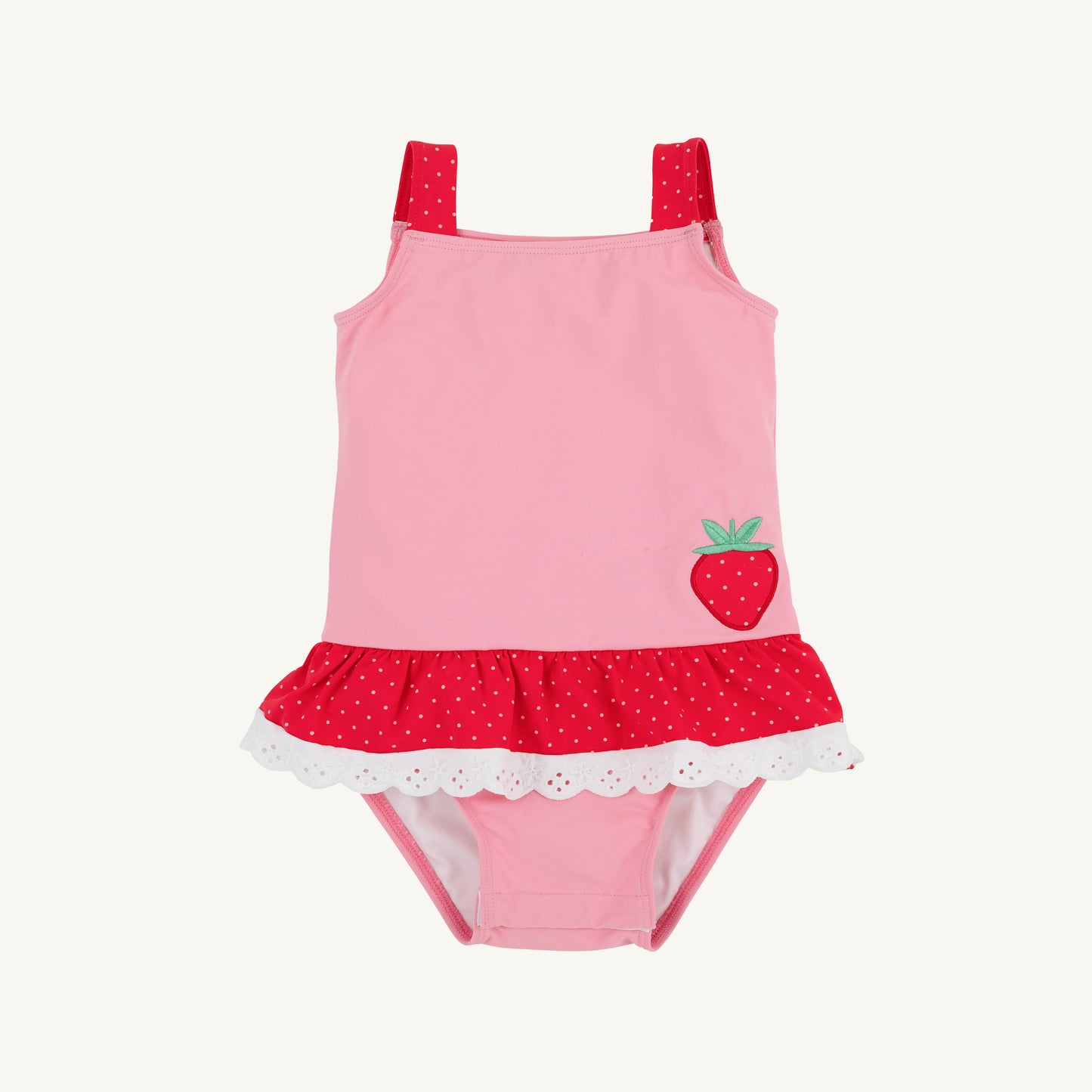 The Beaufort Bonnet Company Hamptons hot pink, Richmond red, and strawberry Grace Bay bathing suit on a hanger.