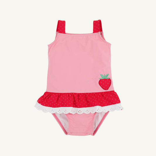 The Beaufort Bonnet Company Hamptons hot pink, Richmond red, and strawberry Grace Bay bathing suit on a hanger.