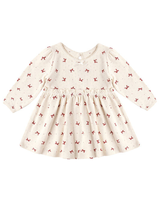 Red Bows Alda Dress by Quincy Mae featuring a charming design with red bows, perfect for little girls' special occasions.