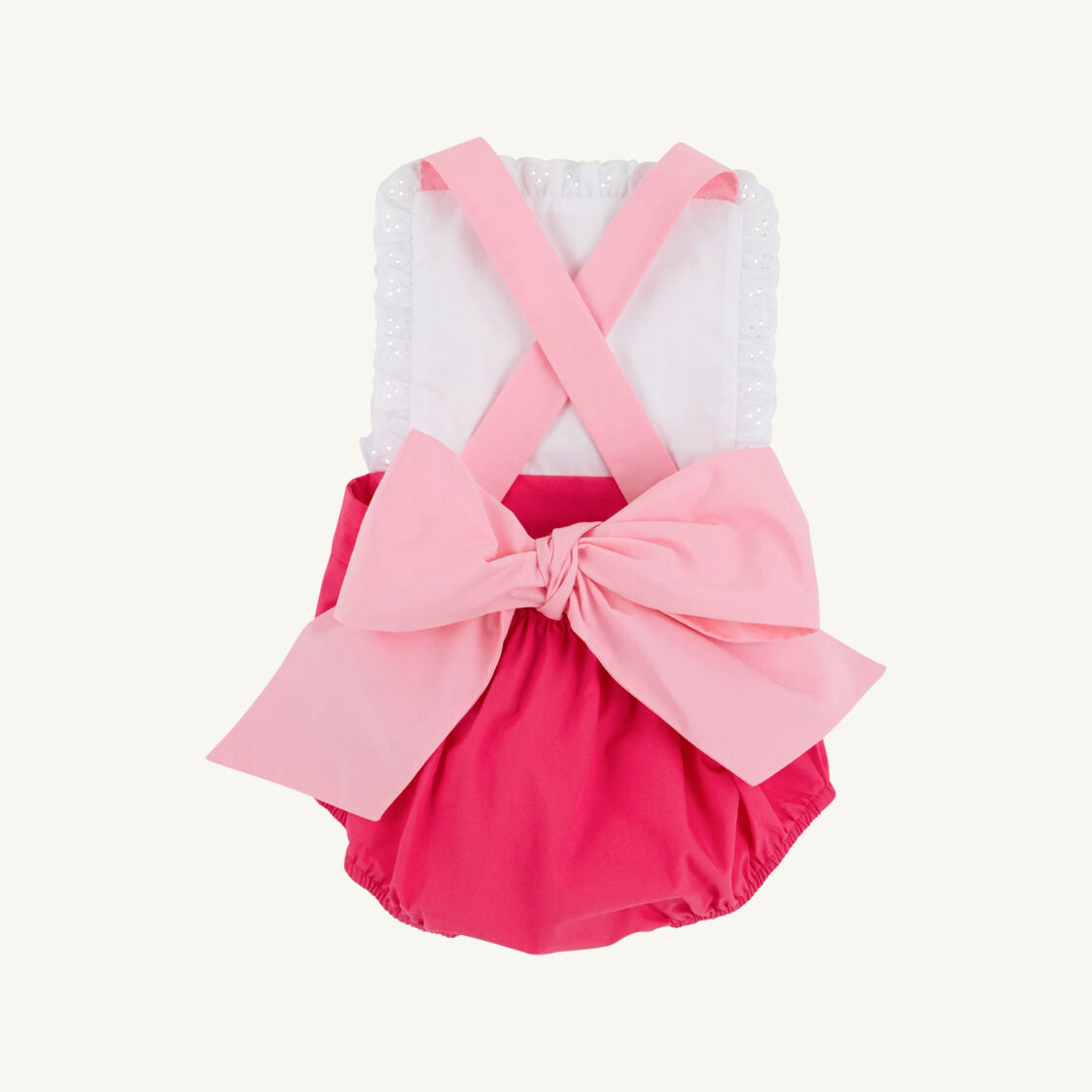 Pink Sally sunsuit with palm tree print from The Beaufort Bonnet Company, featuring pink and sandpearl accents for a toddler girl.