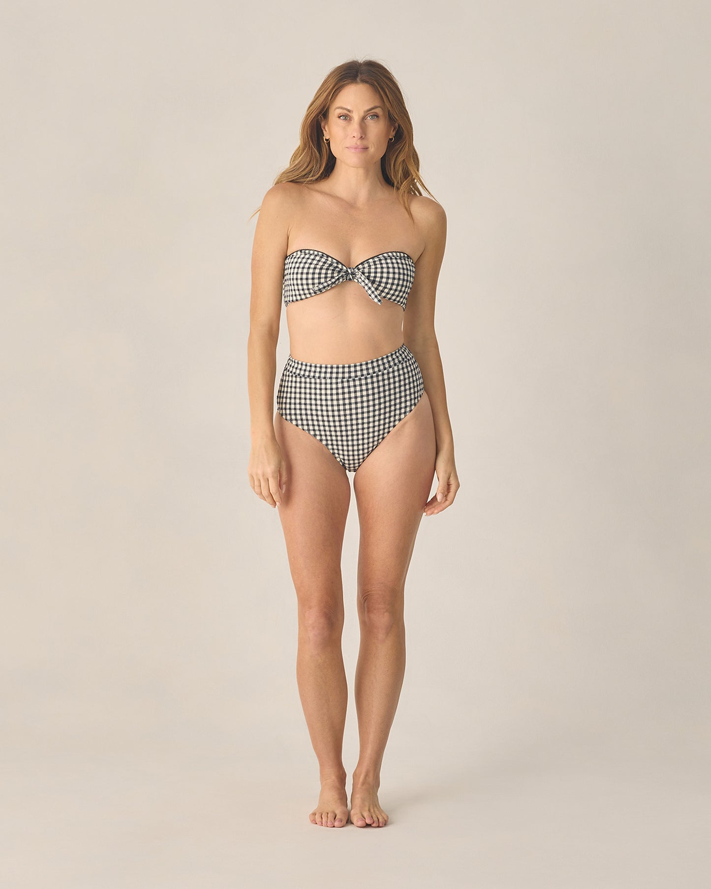 Women's black gingham bandeau bikini top with knotted front by Rylee & Cru, featuring a strapless, stylish swimwear design.