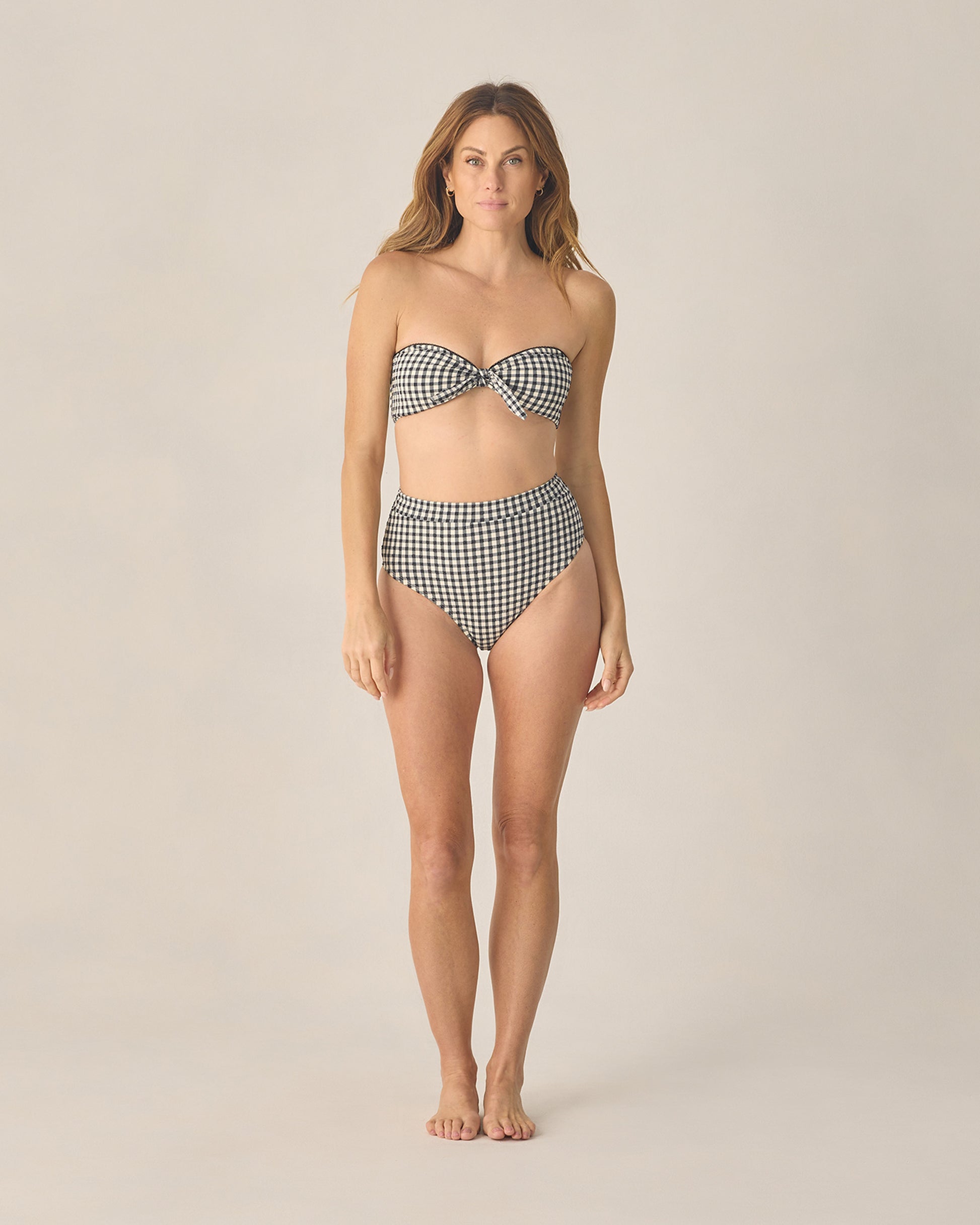 Women's black gingham bandeau bikini top with knotted front by Rylee & Cru, featuring a strapless, stylish swimwear design.