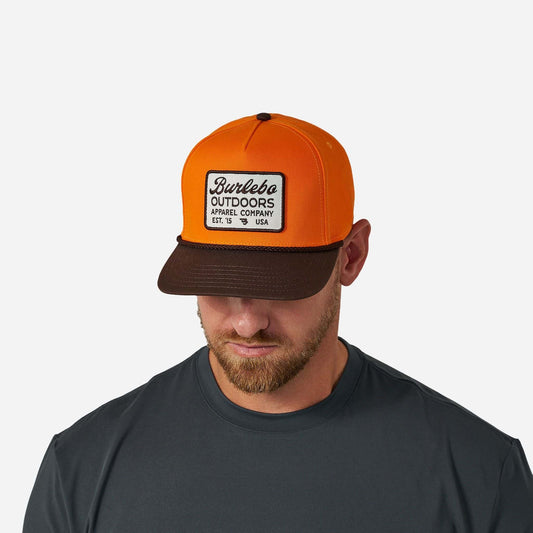 Youth Blaze Outdoors Cap by Burlebo, featuring a lightweight design and adjustable strap, shown in a vibrant outdoor setting.