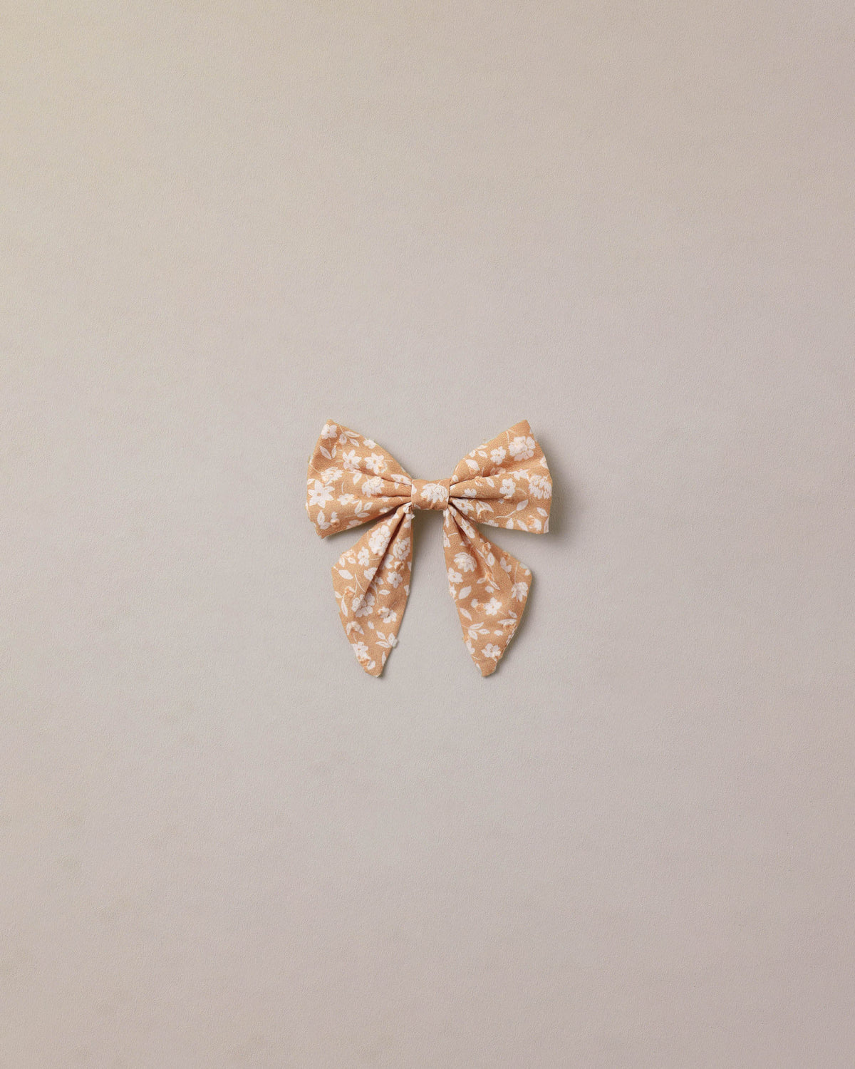 Golden Meadow Norah Bow by Noralee, a stylish fabric hair accessory featuring a large, elegant bow on a neutral background.