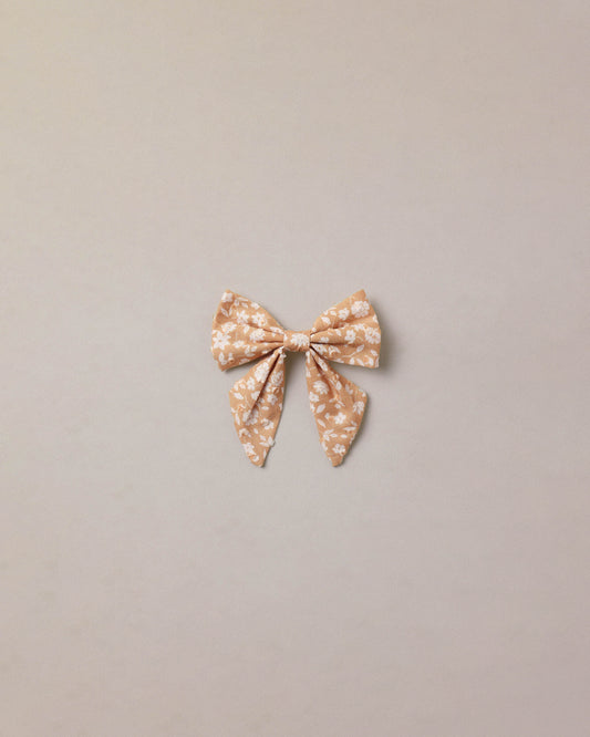 Golden Meadow Norah Bow by Noralee, a stylish fabric hair accessory featuring a large, elegant bow on a neutral background.