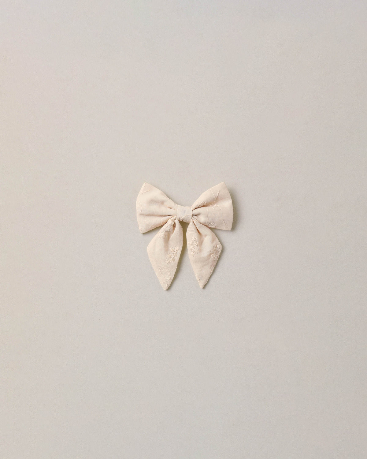 Noralee embroidered floral Norah bow with detailed embroidery and vibrant floral design, perfect for accessories or hair adornment.