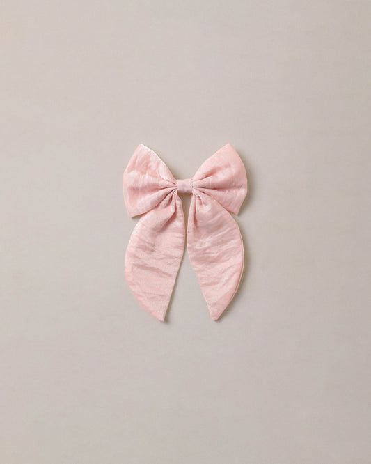 Noralee Rose Shimmer Everly Bow, a stylish hair accessory with a shimmering rose design and elegant bow detail.