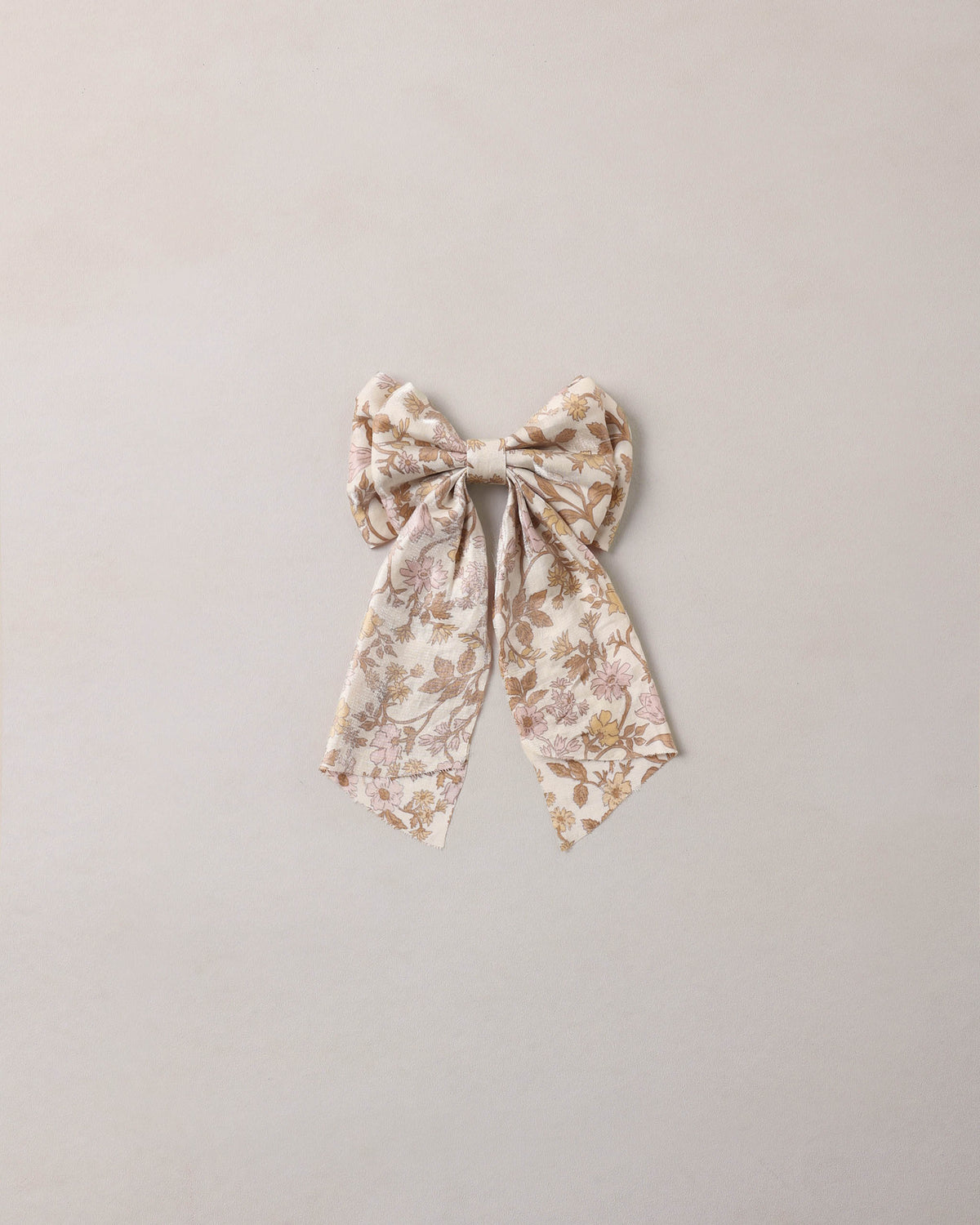 Noralee Wildflower Alice Bow, a colorful fabric hair accessory with floral patterns and a tied bow design.