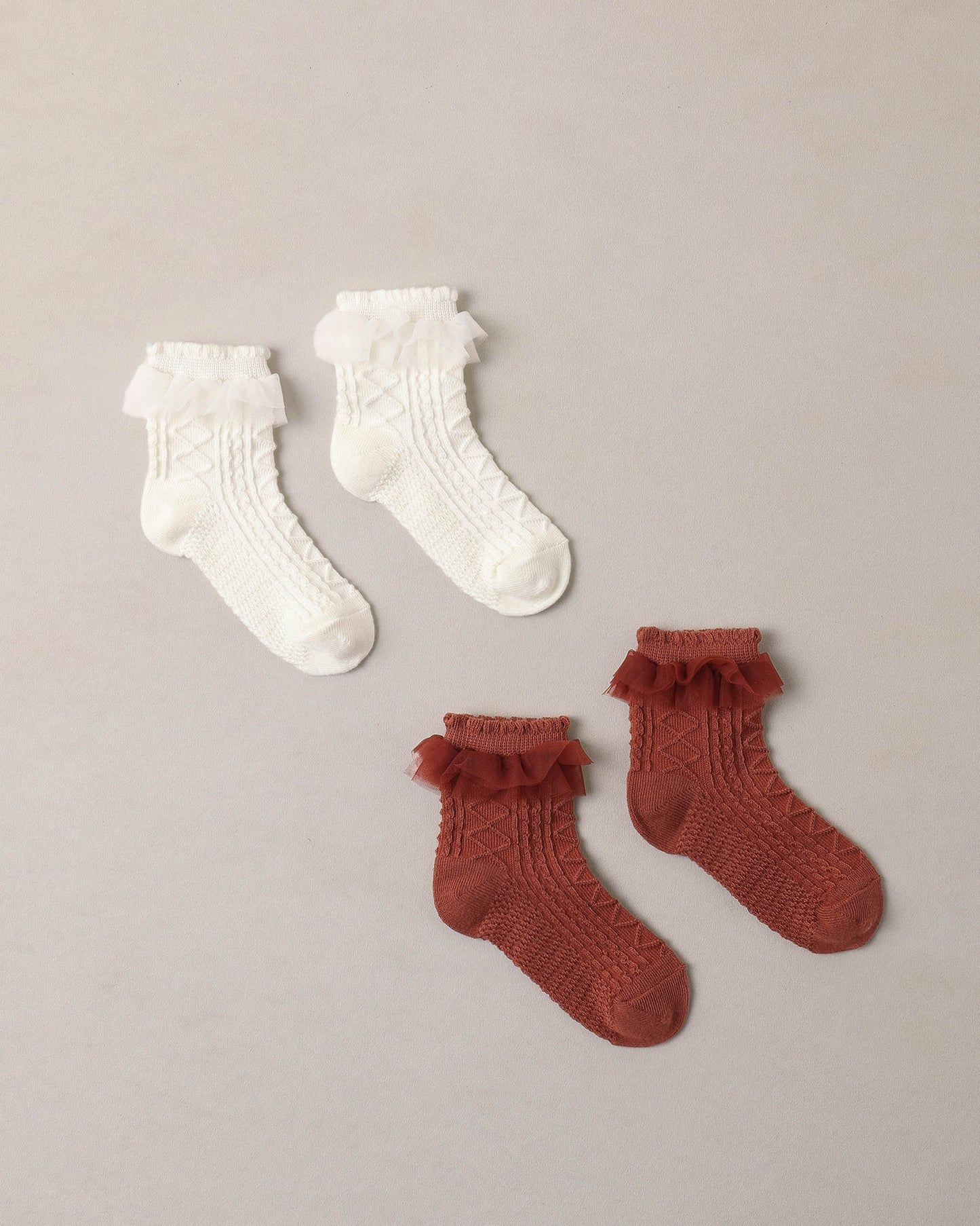 Ivory ruffle socks by Noralee featuring delicate lace and ruffled trim, perfect for adding a feminine touch to any outfit.