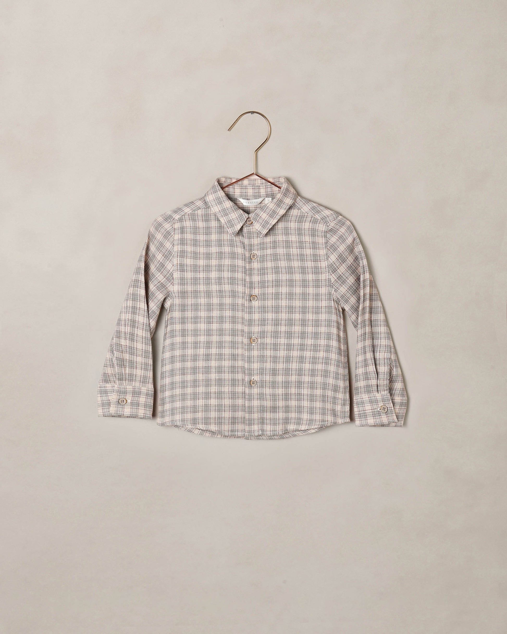 Noralee Fall Plaid Harrison Button Down shirt featuring a classic plaid pattern and button-up front, displayed on a hanger.