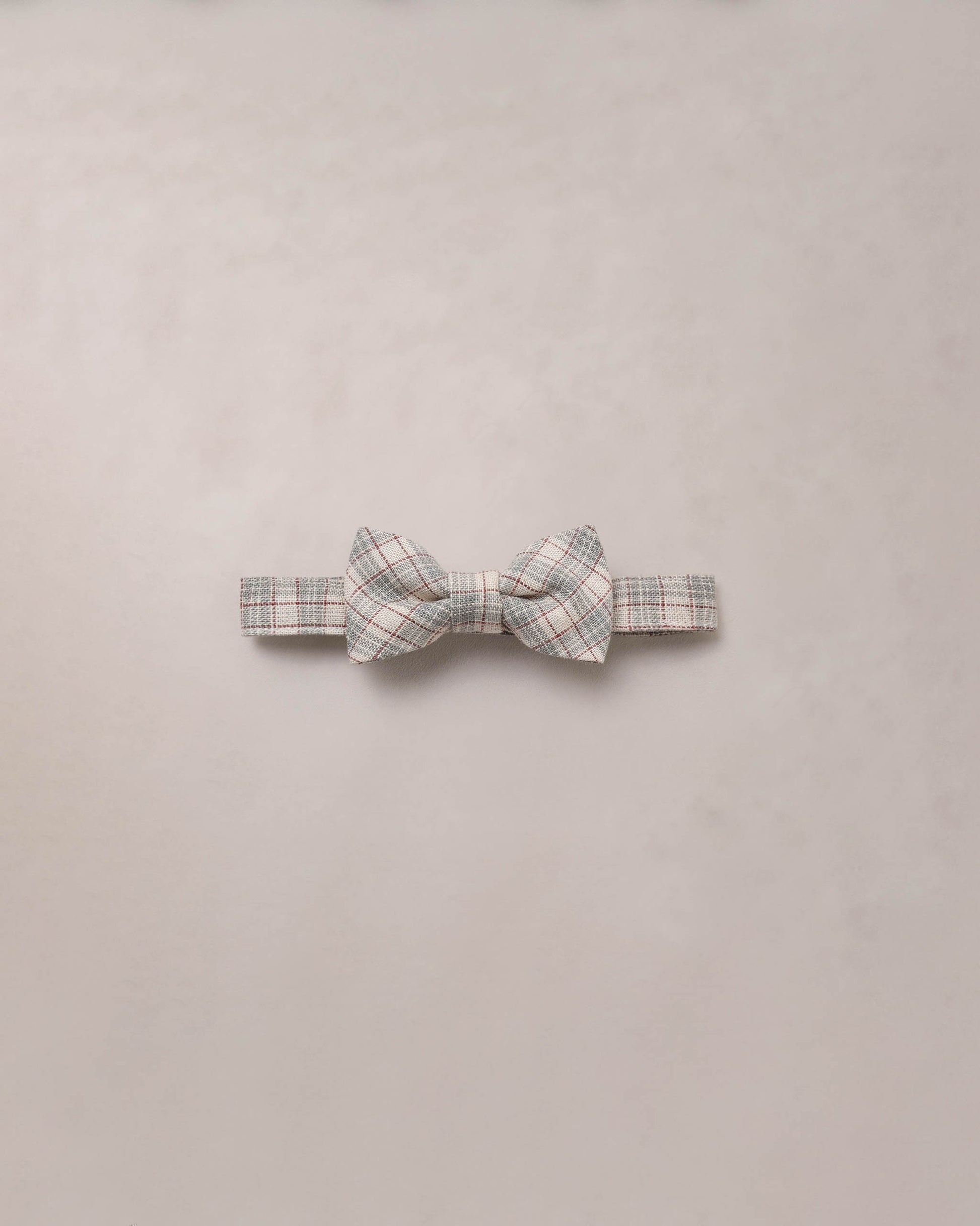 Noralee fall plaid bow tie featuring a classic red, black, and white checkered pattern, perfect for stylish seasonal outfits.