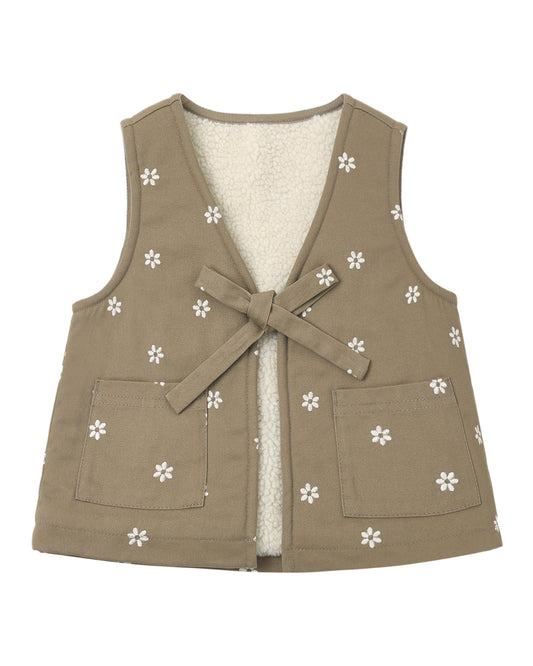 Embroidered daisies on Rylee & Cru utility vest, showcasing floral embroidery and functional design with multiple pockets.