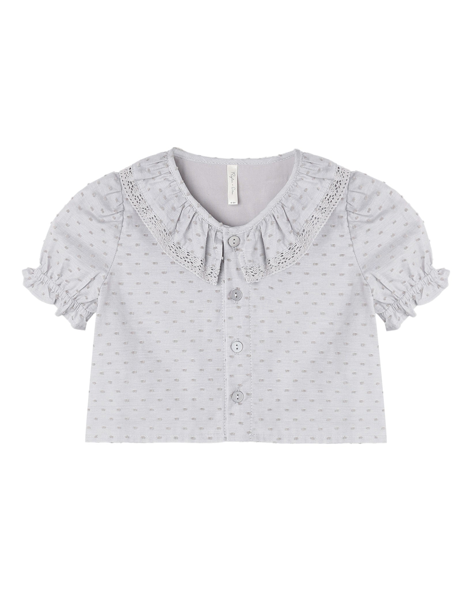 Dusty blue Bella blouse by Rylee & Cru featuring long sleeves, a relaxed fit, and soft fabric, displayed on a hanger.