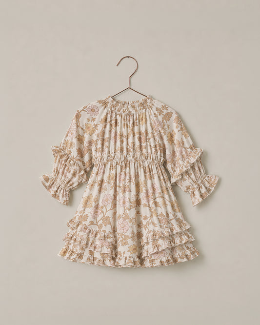 Noralee Harvest Bloom Mirabelle Dress displayed on a hanger with floral pattern and flowing fabric.