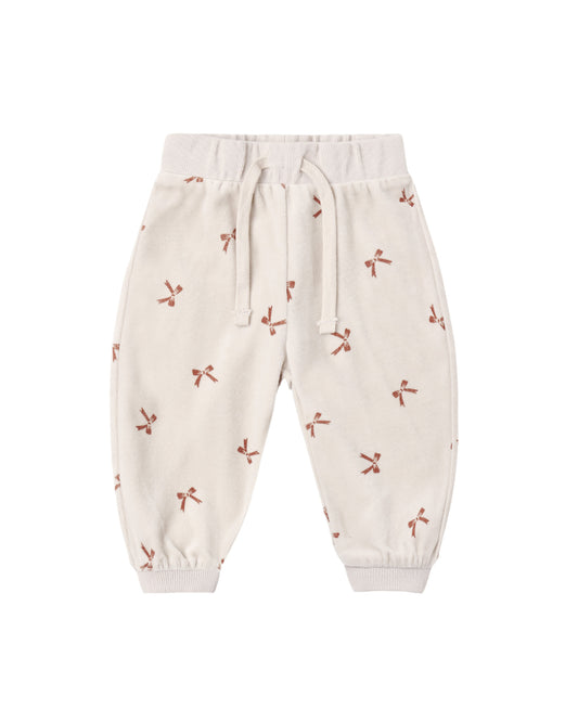Red velour relaxed sweatpant with bow details from Quincy Mae, featuring soft fabric and comfortable fit.