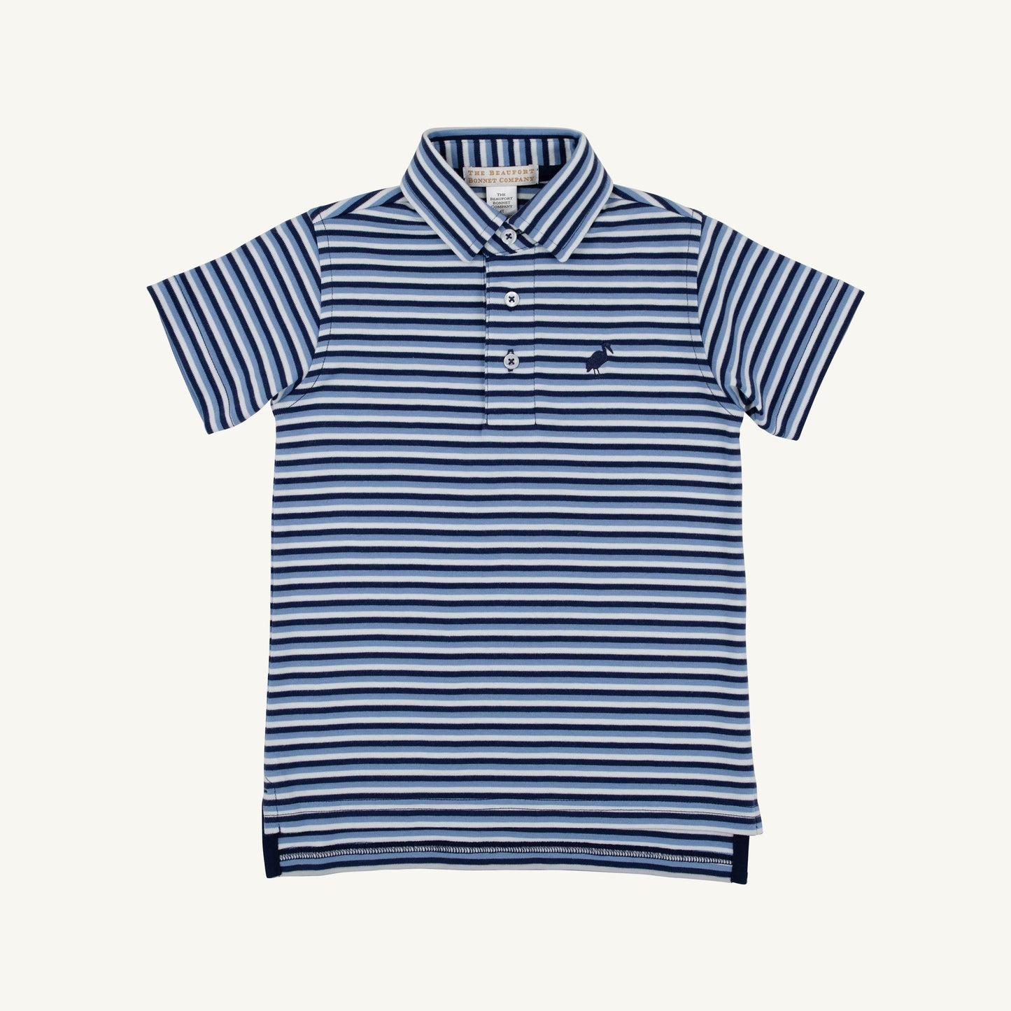 The Beaufort Bonnet Company Prim and Proper Polo featuring Sumner County Stripe in Barbados Blue and Nantucket Navy, styled on a child.