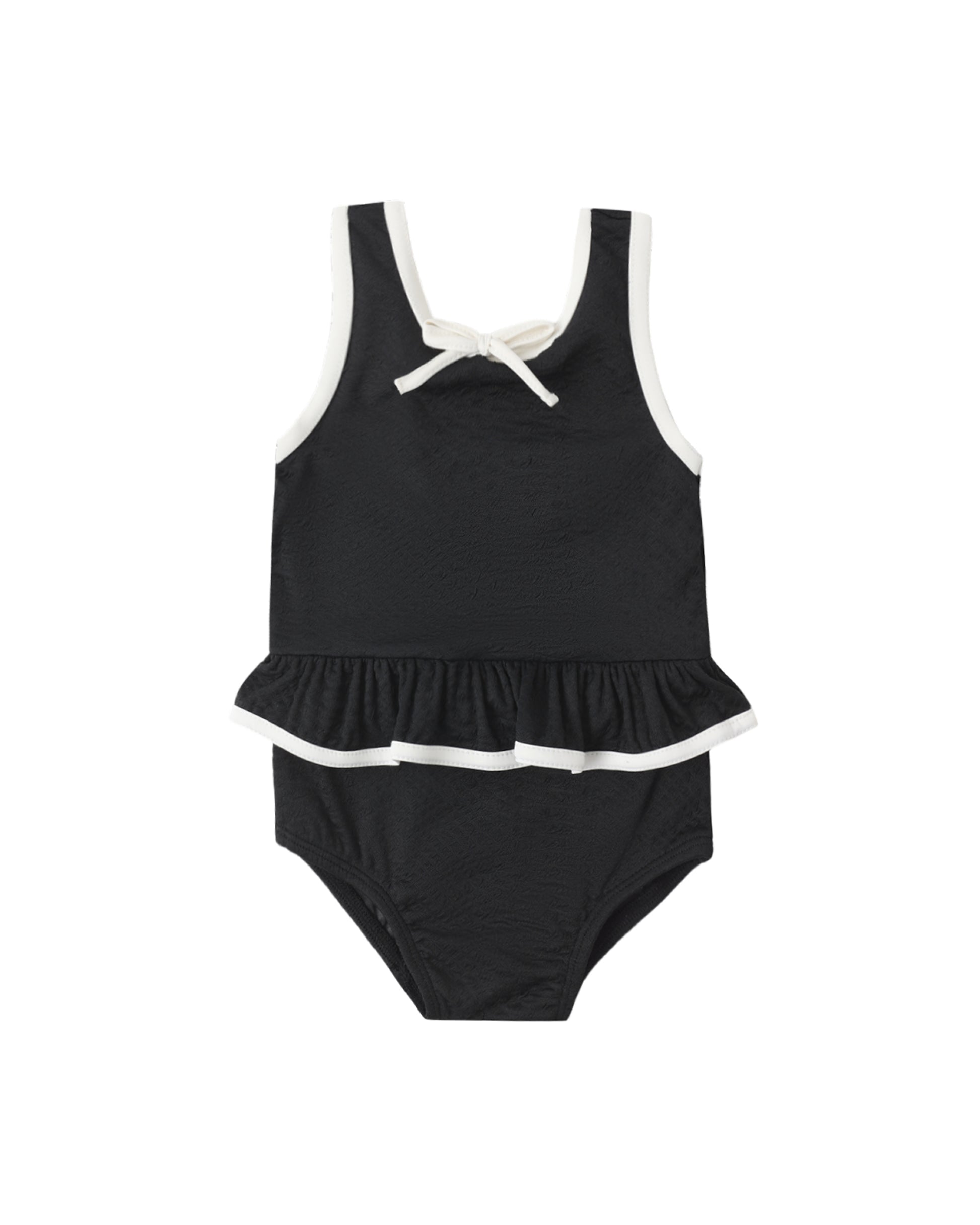 Black skirted one-piece swimsuit by Rylee & Cru featuring a sleek design with a fitted silhouette and shoulder straps.