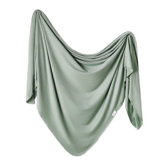 Copper Pearl Copper Pearl Knit Swaddle in Briar color, soft and cozy for newborns, with a textured knit pattern.