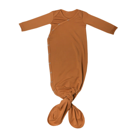 Copper Pearl newborn knotted gown in camel color, soft and cozy for infants, with a relaxed fit and gentle fabric.